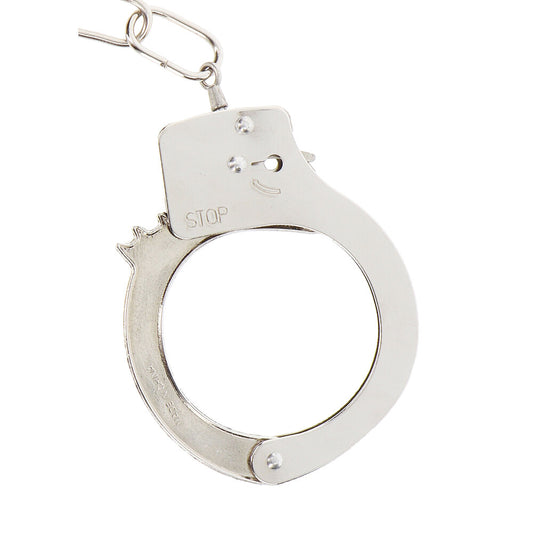 Shiny silver metal toy handcuffs for playful bondage, part of the Toy Joy collection.
