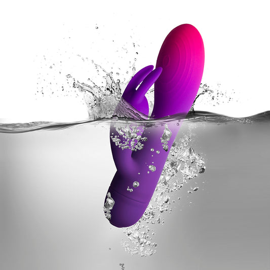 Glow-in-the-dark rabbit vibrator with textured shaft and curved tip for enhanced pleasure.
