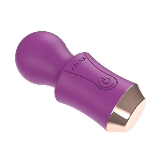 A compact, travel-sized vibrator wand from Xocoon, showcasing its smooth finish and sleek design. Mini vibrator.