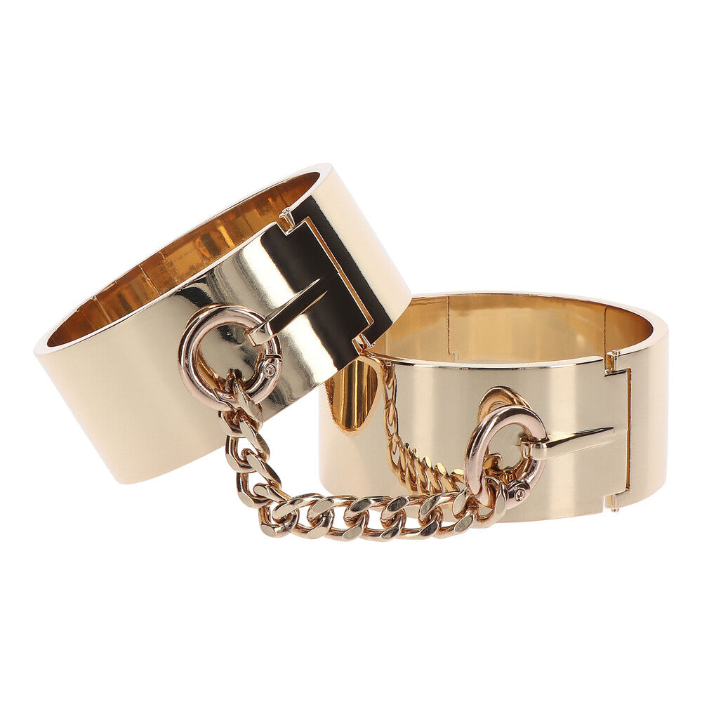 Taboom Dona Slave wrist cuffs in black leather with polished silver-tone metal hardware