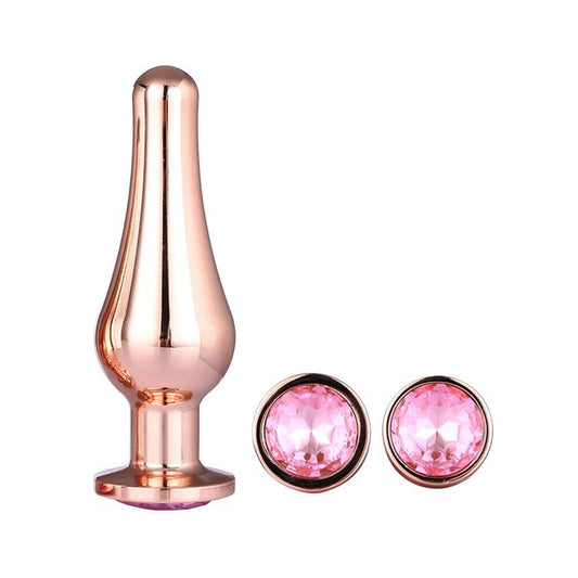 A set of three rose gold-coloured metal butt plugs, jewel-encrusted for a touch of sparkle.