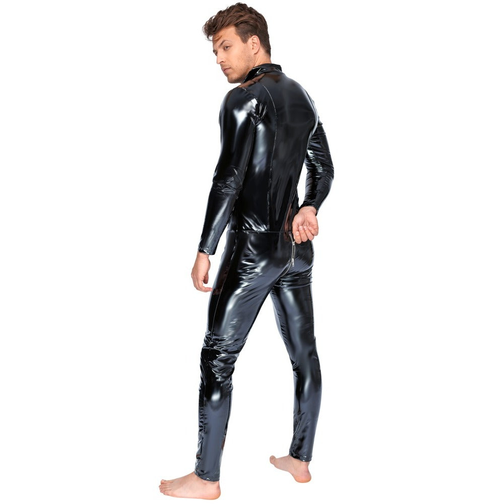 Male model wearing a black vinyl jumpsuit with a prominent zip, styled for a night out.