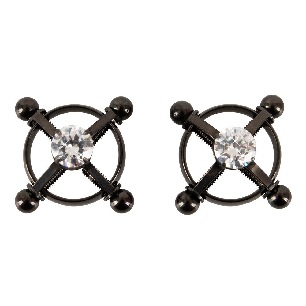 A pair of shiny, star-shaped nipple jewels for body adornment, perfect for adding some sparkle.