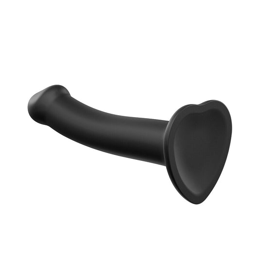 Close-up of a medium black, dual-density silicone strap-on dildo, bendable for versatile use.