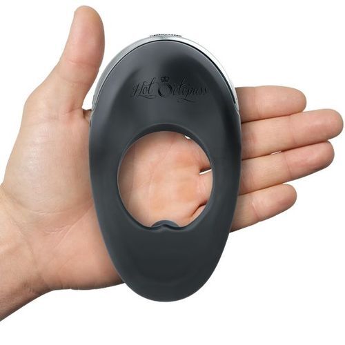 Close-up of a vibrating love ring in grey silicone for enhanced pleasure.