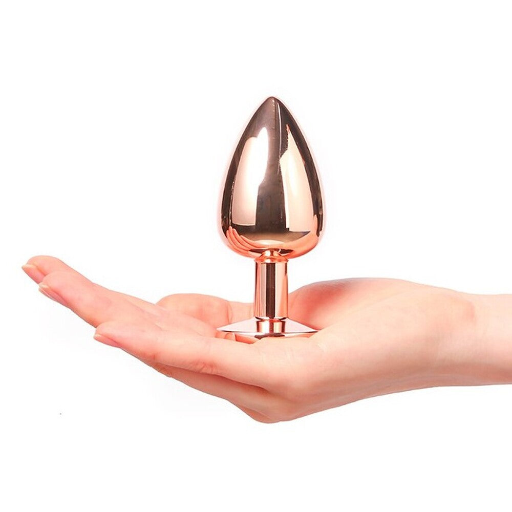 Rose gold large butt plug with diamond-shaped jewel detail for intimate pleasure.