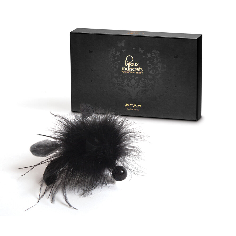 Bijoux Indiscrets feather tickler with a fluffy pom pom in a playful accessory.