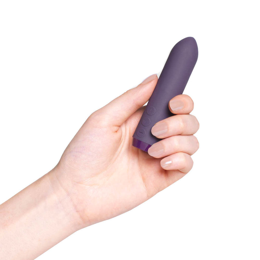 A petite, purple bullet vibrator by je joue, perfect for discreet sensual exploration.