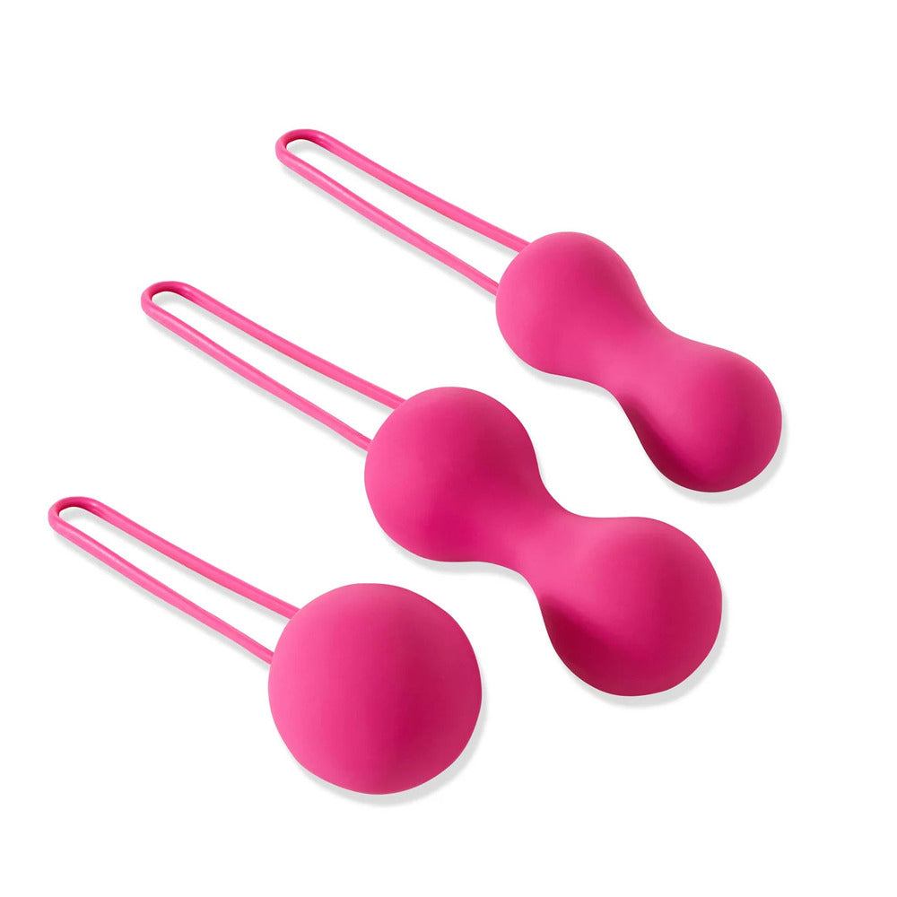 Fuchsia ami kegel balls for pelvic floor exercise, smooth finish and weighted design.