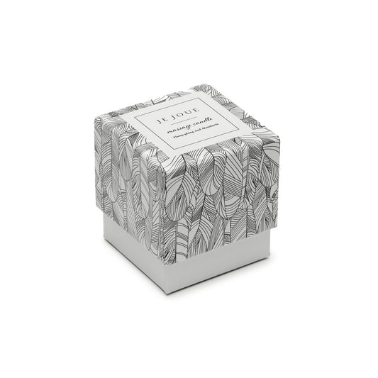 Je Joue massage candle in warm tones with ylang-ylang and mandarin scent, for bath and massage.