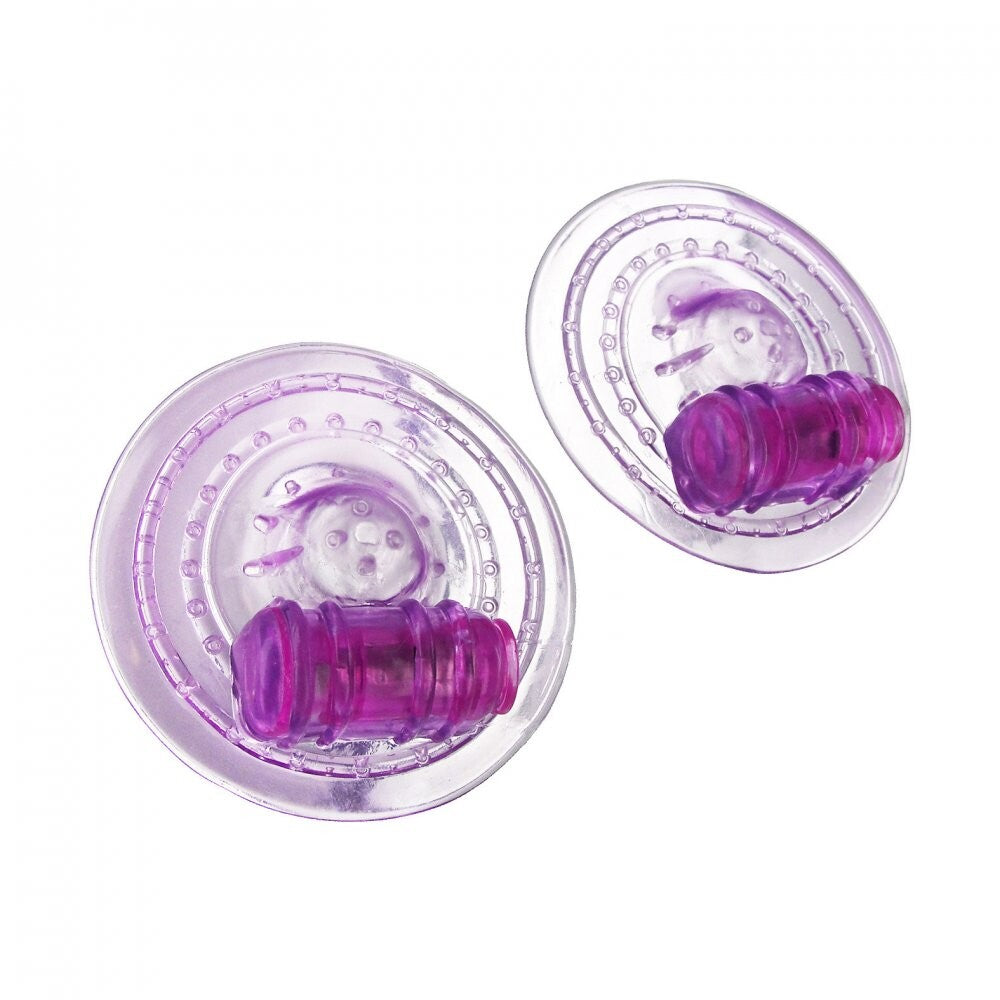 Trinity Vibes Razzles vibrating nipple pads, pink silicone with a smooth, matte finish.