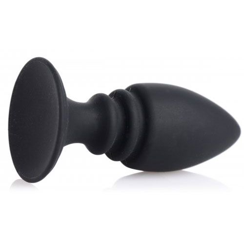 Black silicone cock ring harness featuring an integrated anal plug for bondage play