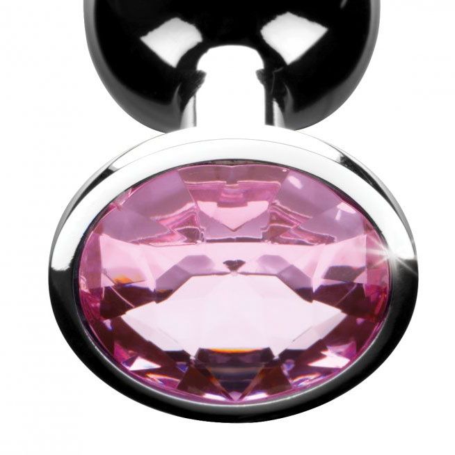 A shiny pink medium-sized butt plug with a multifaceted gem at the base.