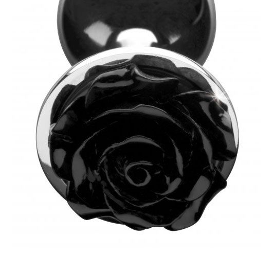 Large black anal plug with a rose detail on the end, shiny finish.