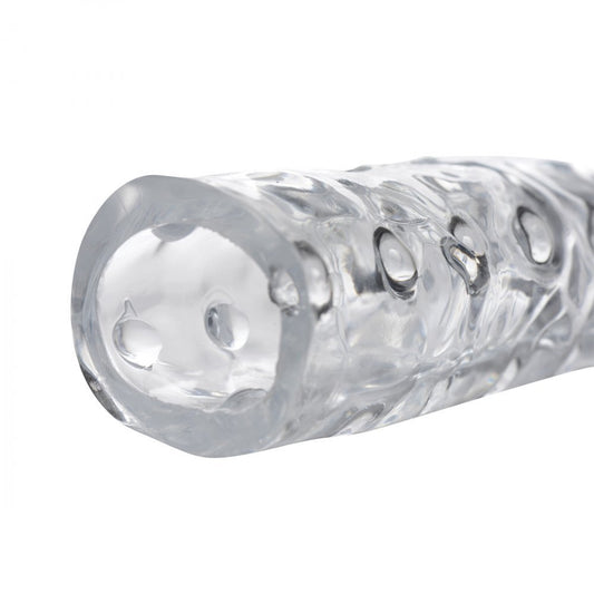 Clear, three-inch penis enhancer sleeve, made of smooth, flexible material for pleasurable use.