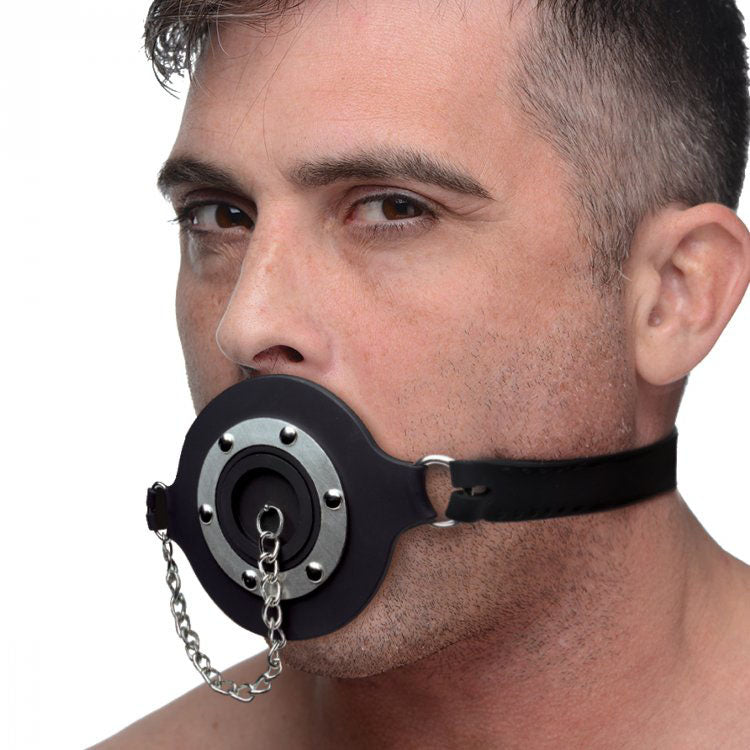 Black silicone gag with a pie-shaped hole, ideal for adult feeding play.