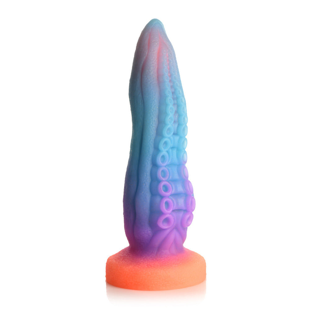 Glow in the dark tentacle-shaped dildo for adult use, made of a flexible material.