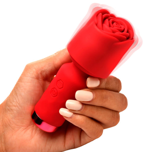 Petite rose-pink mini vibrator wand with a smooth, bloom-like head for intimate massage.