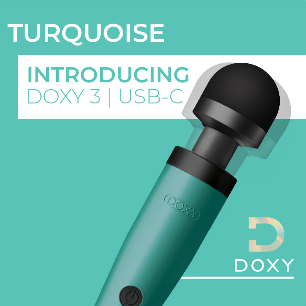 Close-up of a turquoise Doxy Wand 3 massager, USB powered and ready for use.