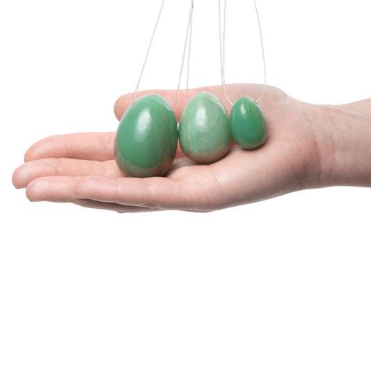 Jade yoni egg set for kegel exercises, polished stones in varying sizes, perfect for pelvic floor workouts.
