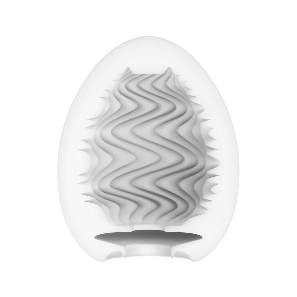 Tenga wind egg masturbator, textured pale pink silicone, a pleasure toy for solo male fun.