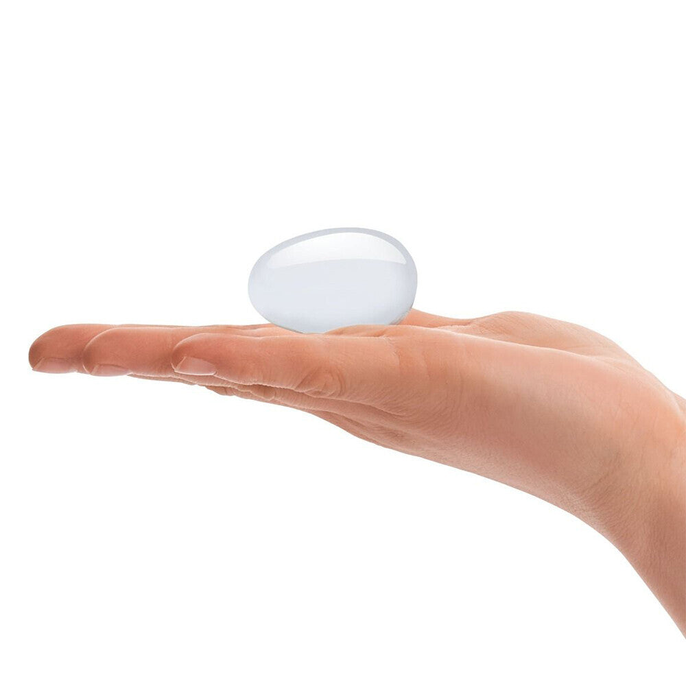 Two clear glass yoni eggs, a set for pelvic floor exercises and pleasure.