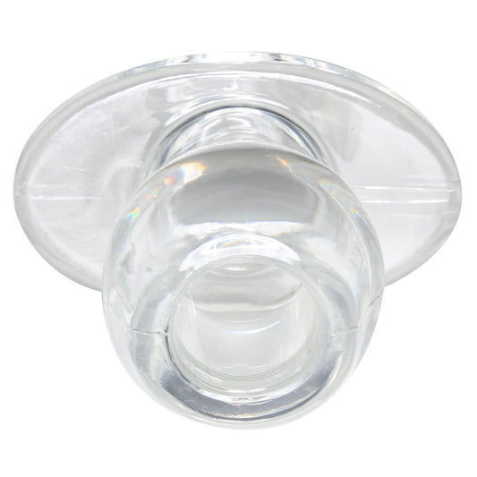 Close-up of a medium-sized clear tunnel plug for ear stretching by Perfect Fit.
