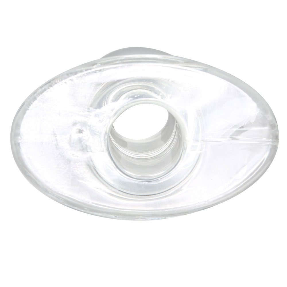 Clear, medium-sized tunnel plug for stretched piercings, showcasing a smooth, polished finish.