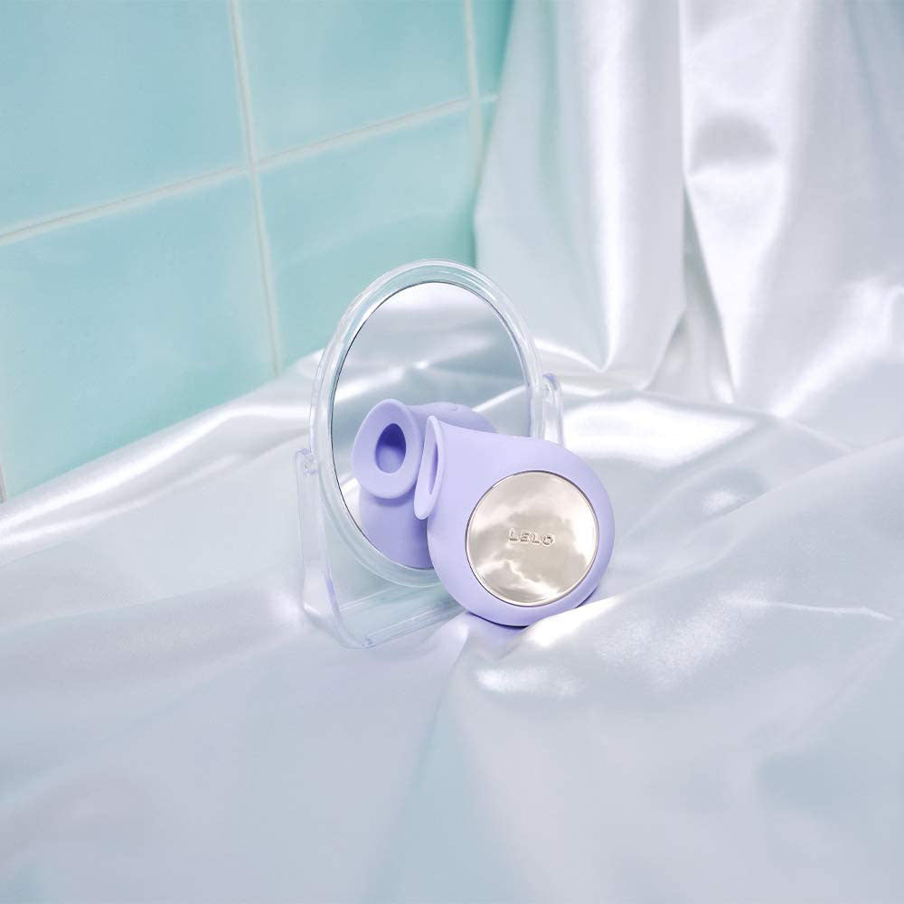 Lilac-coloured sonic wave clitoral massager by lelo, made of smooth, body-safe silicone.