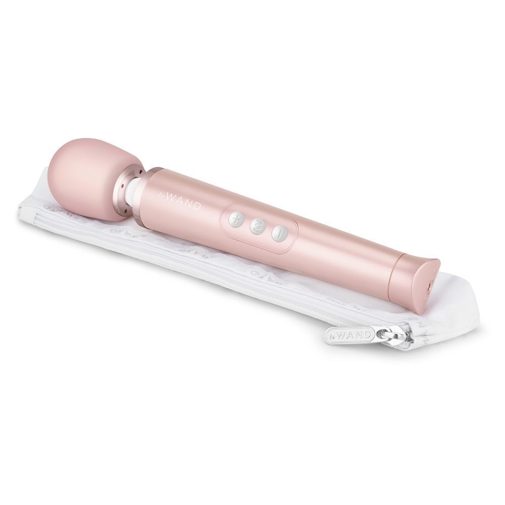 Close-up of the petite gold le wand massager, rechargeable and perfect for travel.