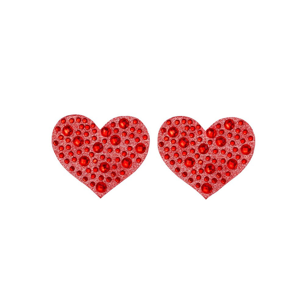 Close-up of sparkly amore-shaped nipple covers, body jewellery for a playful boudoir look.