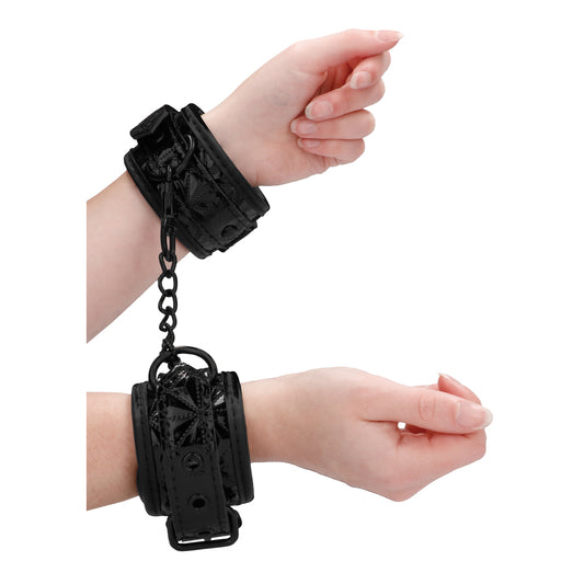 Ouch luxury black hand cuffs from Shots Toys, plush lined for extra comfort.