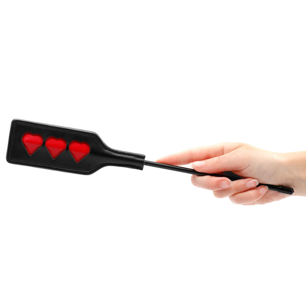 Shots Toys ouch small heart crop, a black textured whip with heart detailing.