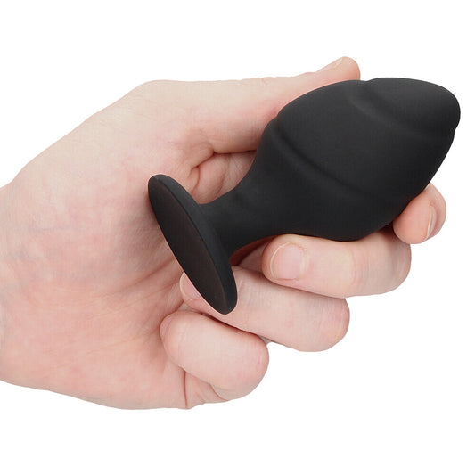 Black silicone butt plug set with swirling design, perfect for anal play.