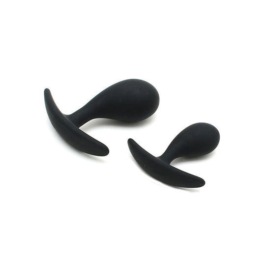 A pair of black, smooth silicone anal plugs from Rimba, one smaller than the other.