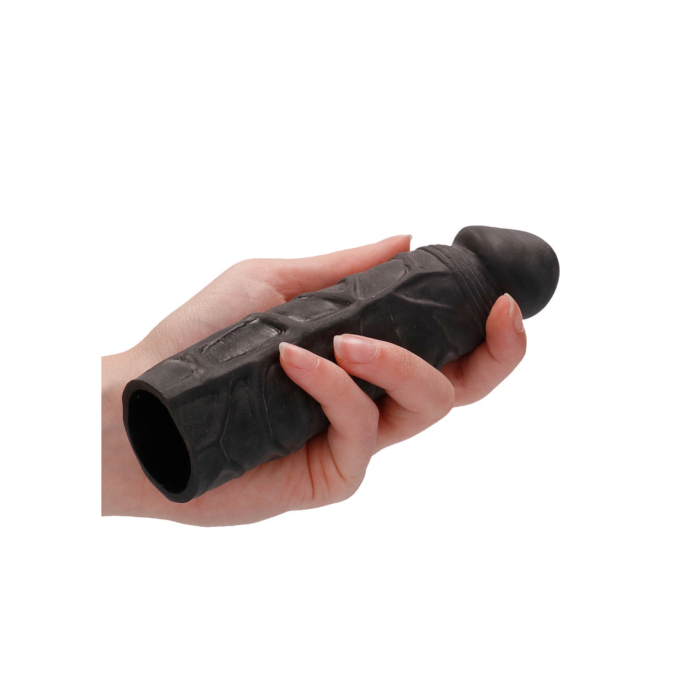 Black RealRock 7 inch penis sleeve from Shots Toys, made of flexible material.