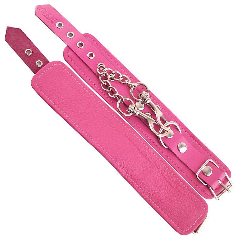 Pink faux leather wrist cuffs, part of the restraints collection from rouge garments.