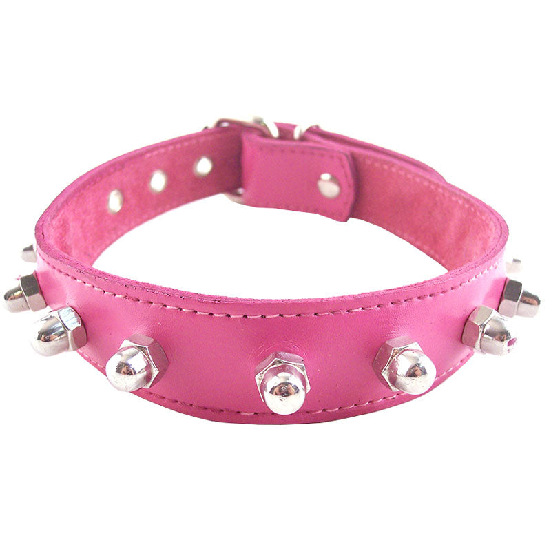 A bright pink dog collar by rouge garments with silver-tone nut detailing around the neck.
