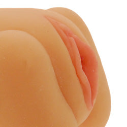 Realistic flesh-toned cooch masturbator from nmc ltd, five inches, for adult use.