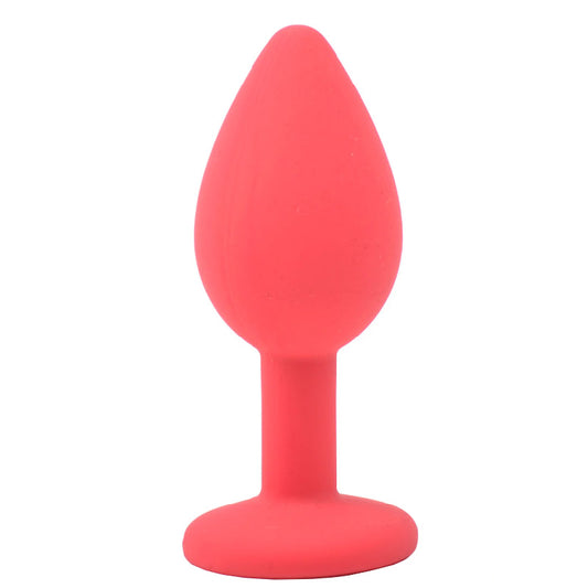 A small, red, silicone butt plug from various toy brands, adorned with a jewelled base.