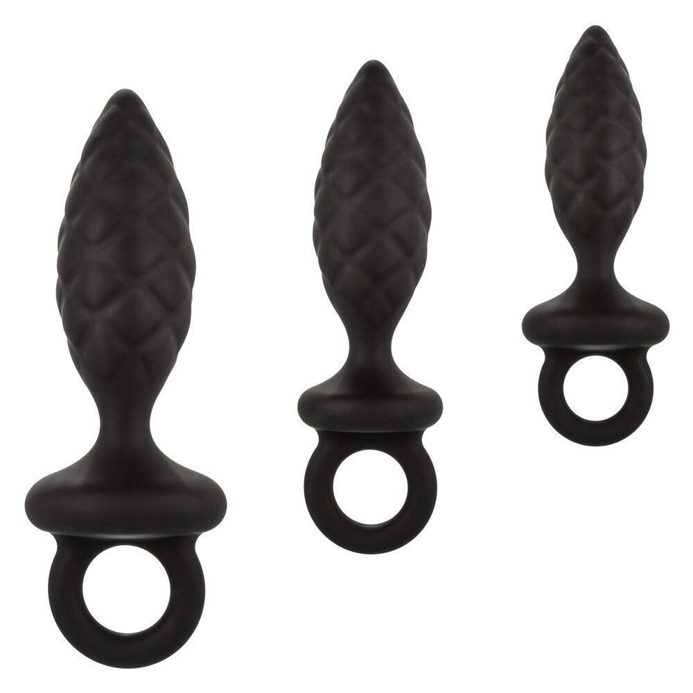 Three different sized silicone anal probes, part of a butt plug kit, silver finish.