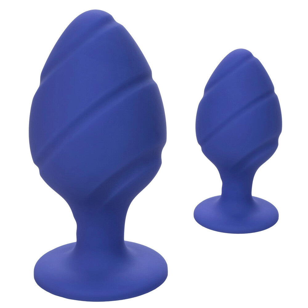A pair of cheeky purple butt plugs by california exotic, graduated sizes, smooth finish.