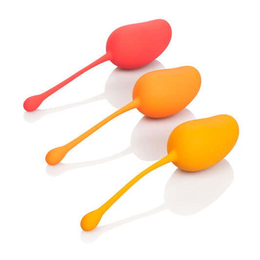 Mango-coloured kegel exercise set from California Exotic for strengthening pelvic floor muscles.