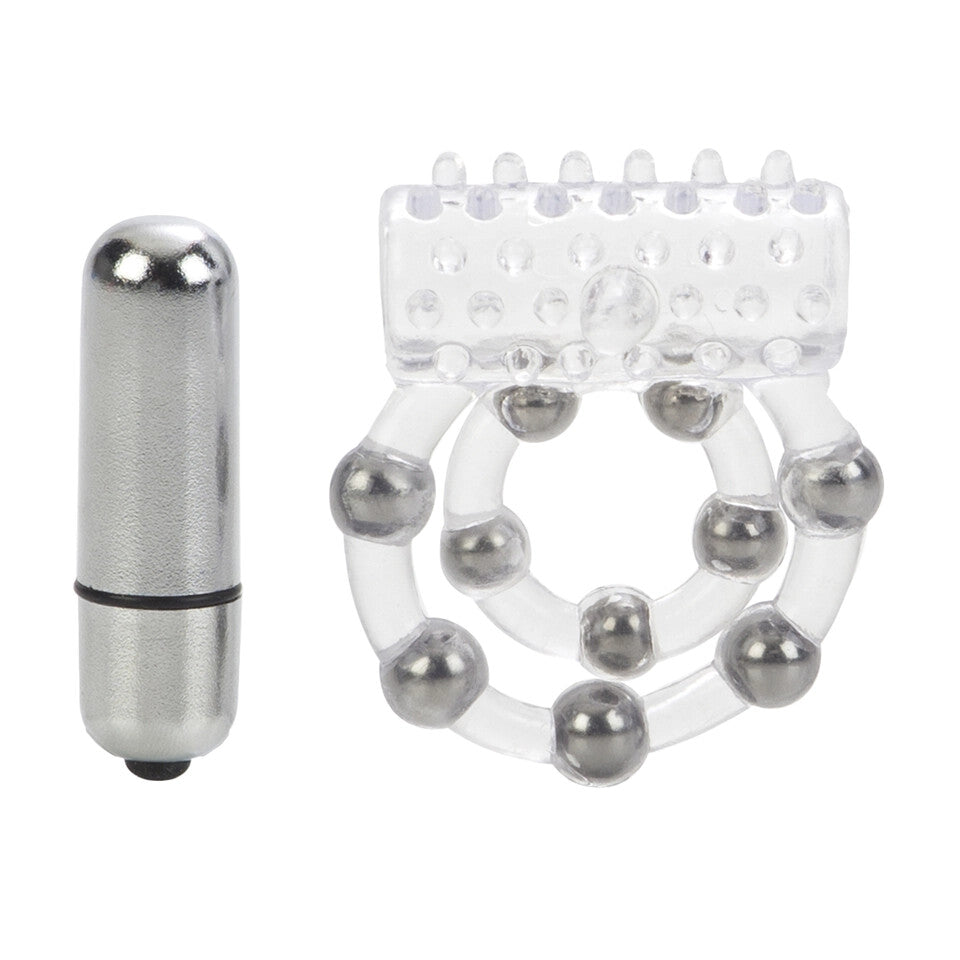 Close-up on a clear silicone cock ring with ten textured beads, used for enhanced pleasure.