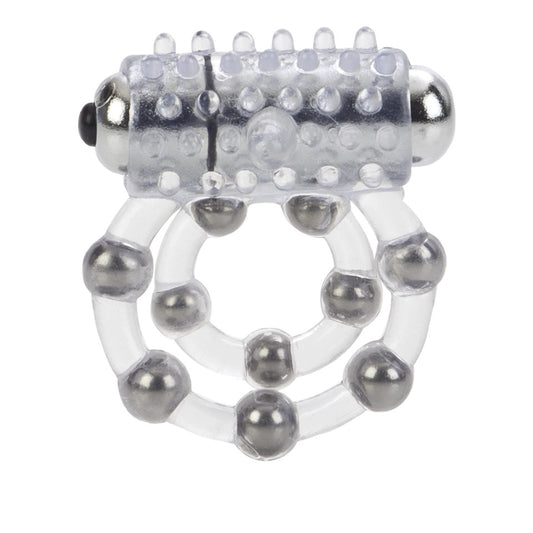 Close-up on a ridged, translucent cock ring with ten prominent beads, for enhanced pleasure.