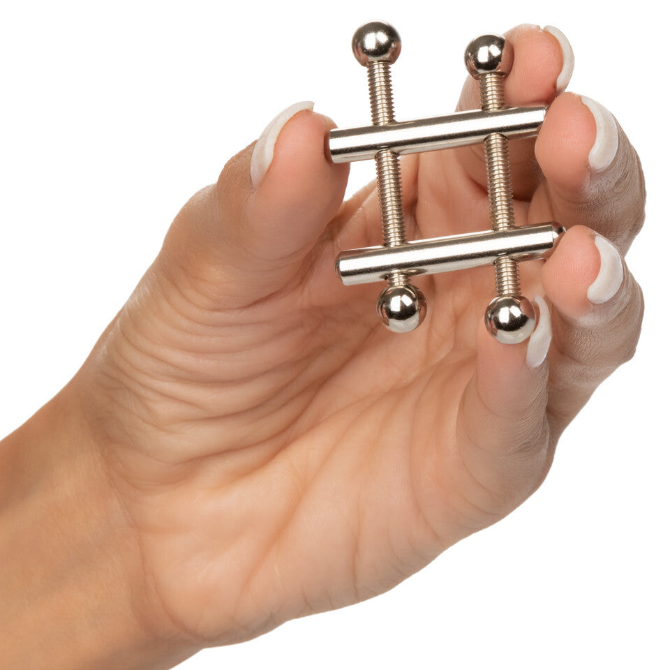 California Exotic nipple vices with a crossbar, designed to grip and tease.