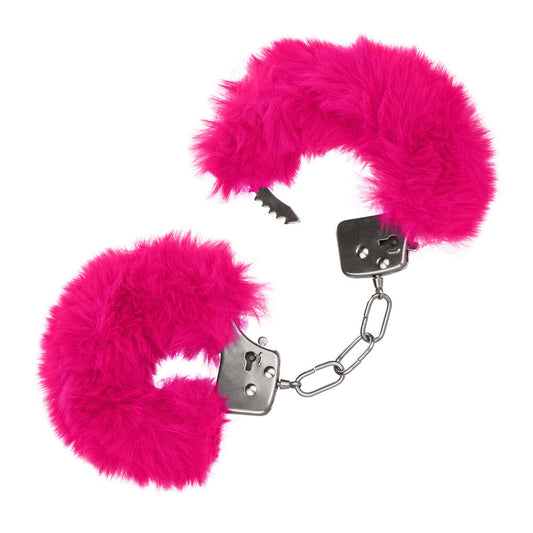 Close-up of fluffy pink furry handcuffs, adding a playful touch to your intimate moments.