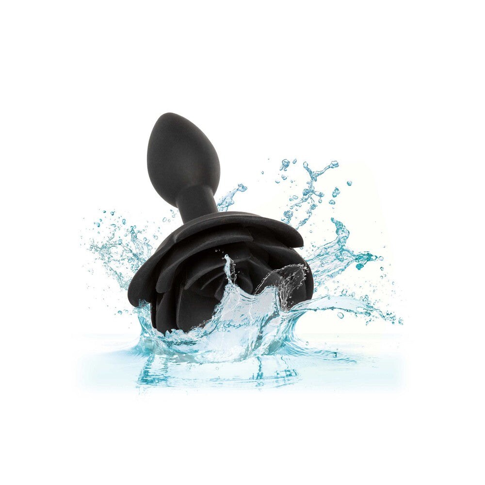 Small rose-shaped anal plug in smooth, forbidden red silicone with a flared base for comfortable use.