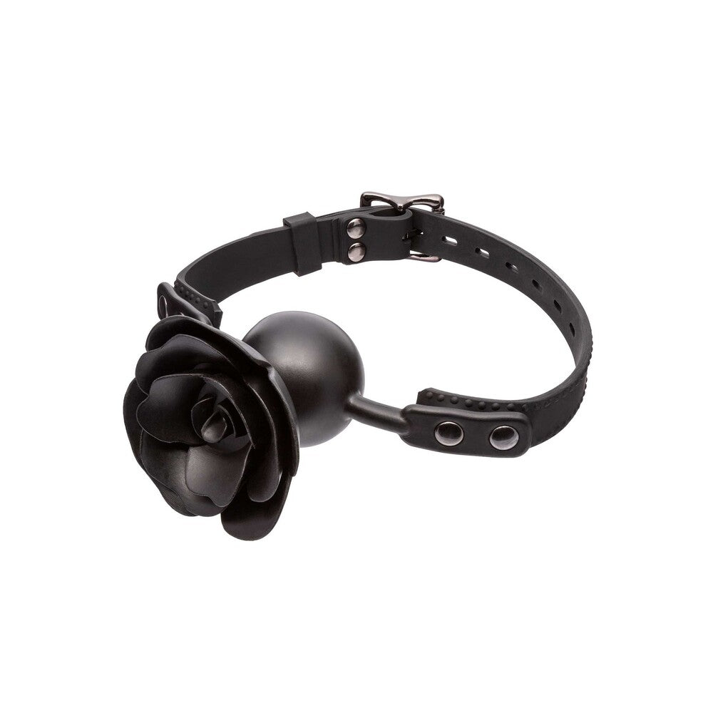 Close-up of a removable, black faux leather gag with a prominent red rose feature.