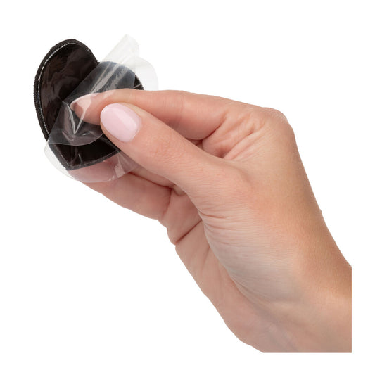 Radiance black heart-shaped nipple pasties from California Exotic, a cheeky lingerie accessory.